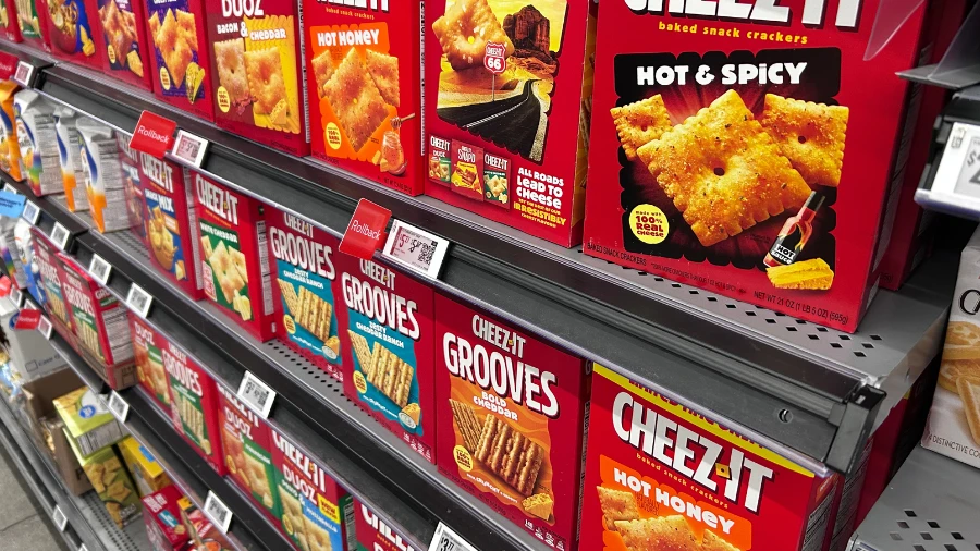 Electronic shelf labels installed on supermarket gondola shelving with wireless access point mounted overhead - real retail ESL deployment